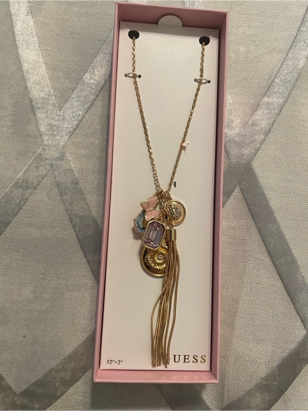 GUESS Gold-Tone Multi-Charm Tassel Necklace with Pink and Blue Accents
